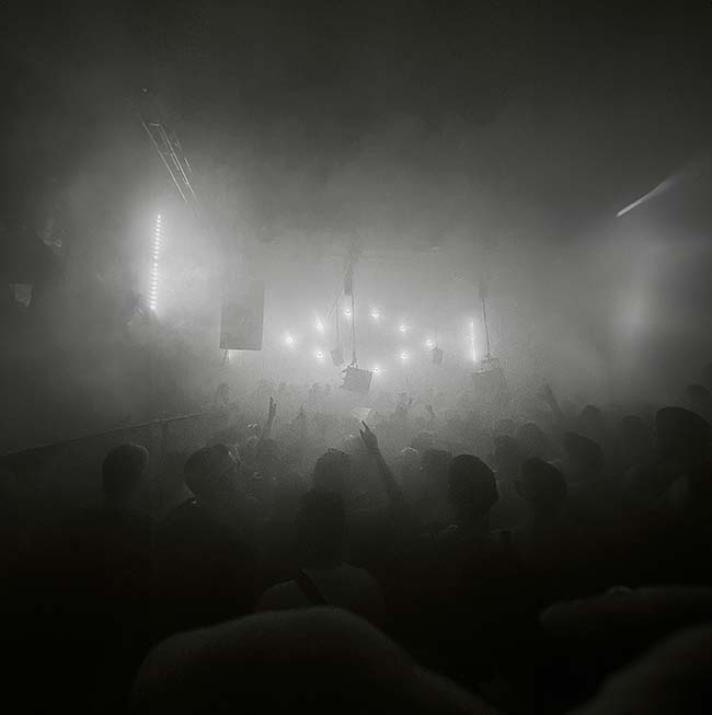 Black and white image of revellers dancing on the dancefloor at Homobloc in Manchester, UK
